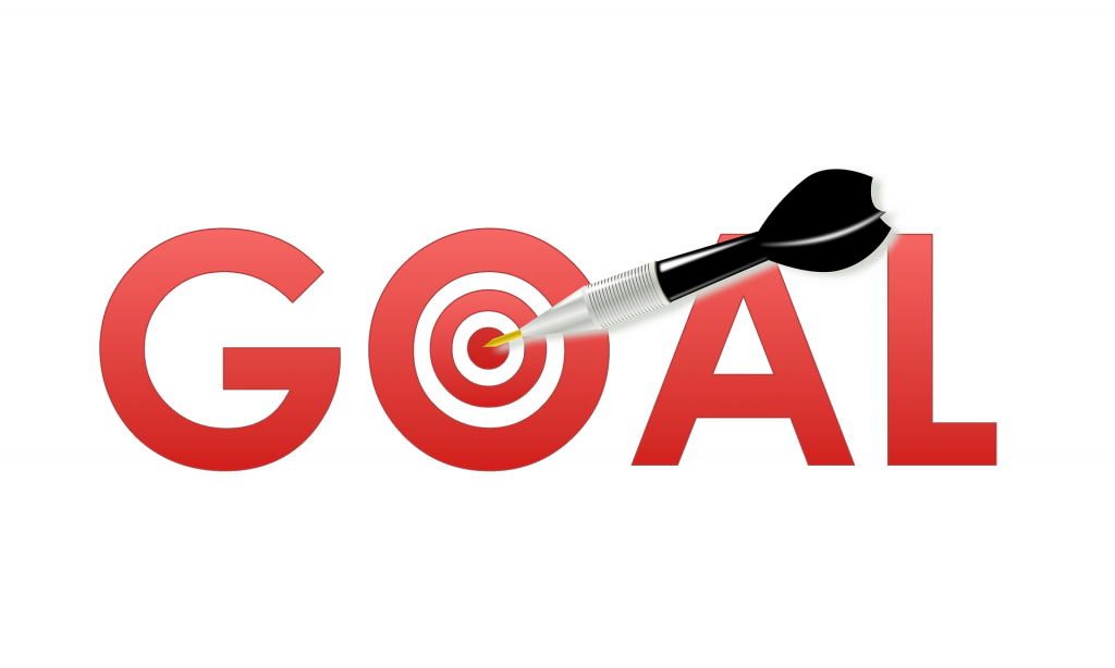 The word "Goal" with a dart hitting the center of a target on the letter "o"